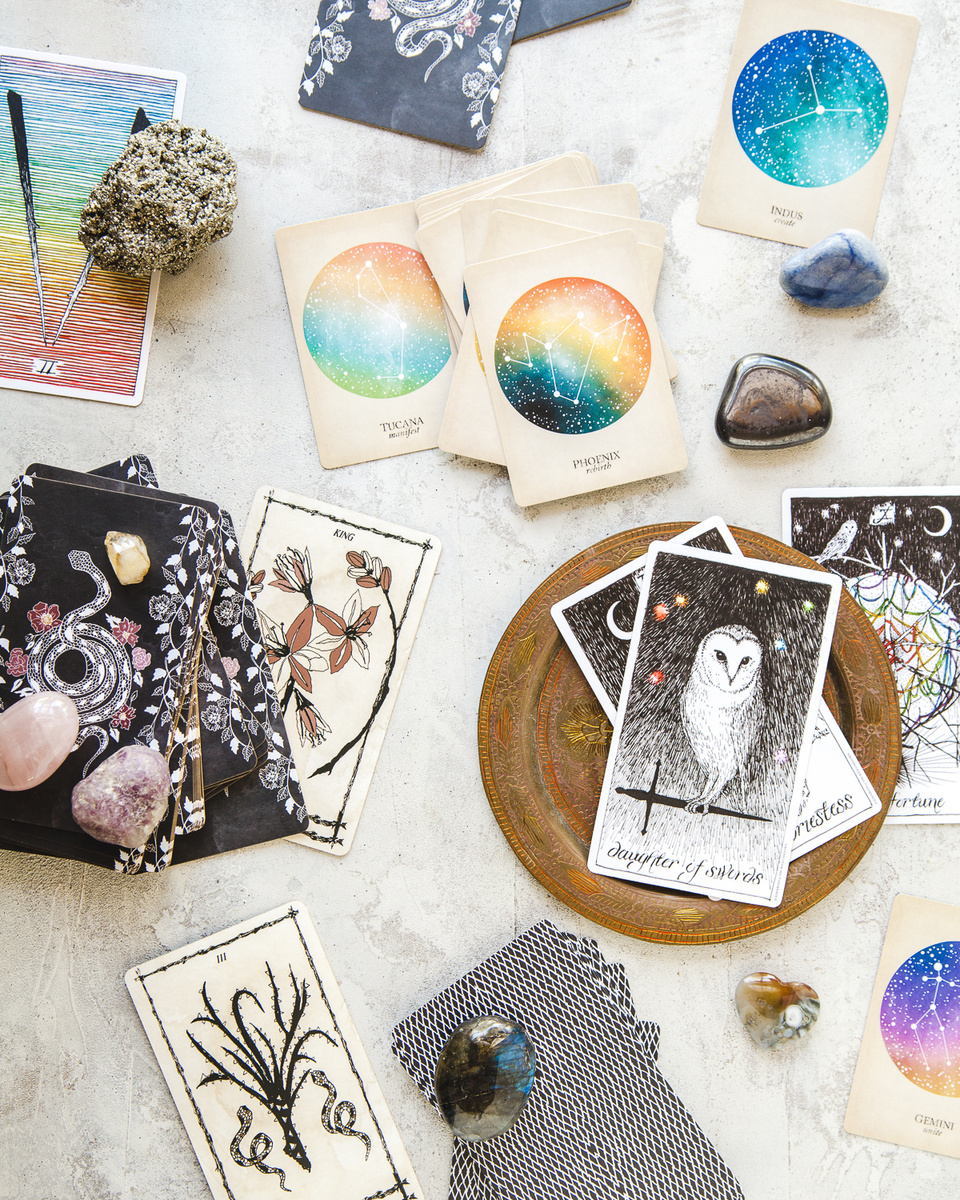 tarot & oracle card flatlay composition with crystals