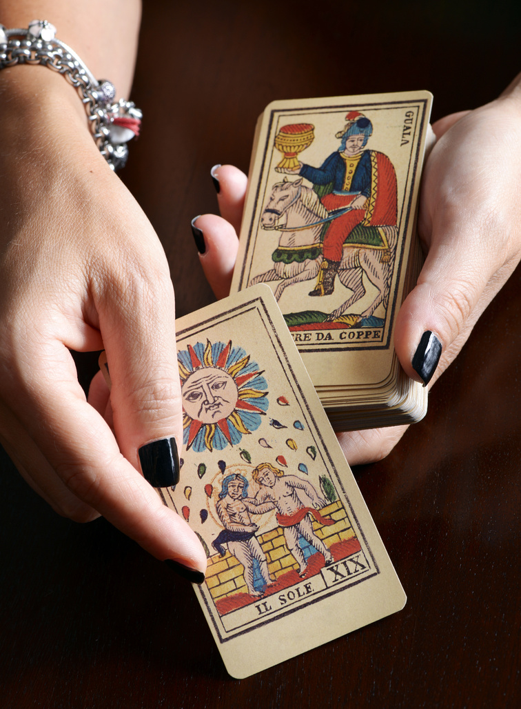 Fortune Teller Showing Vintage Tarot Cards